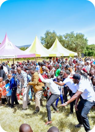 Wahome Foundation gathering under event tents